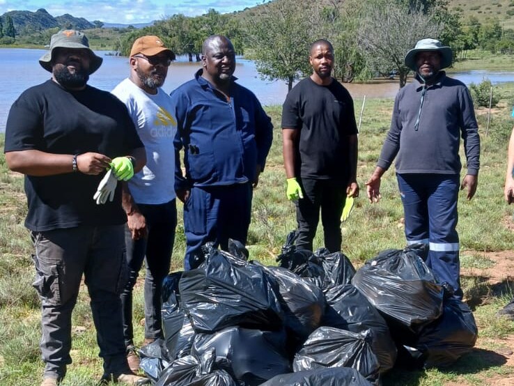 BDA team with bags of refuse collected at De Bruin Dam during the International Cleaning Campaign Day